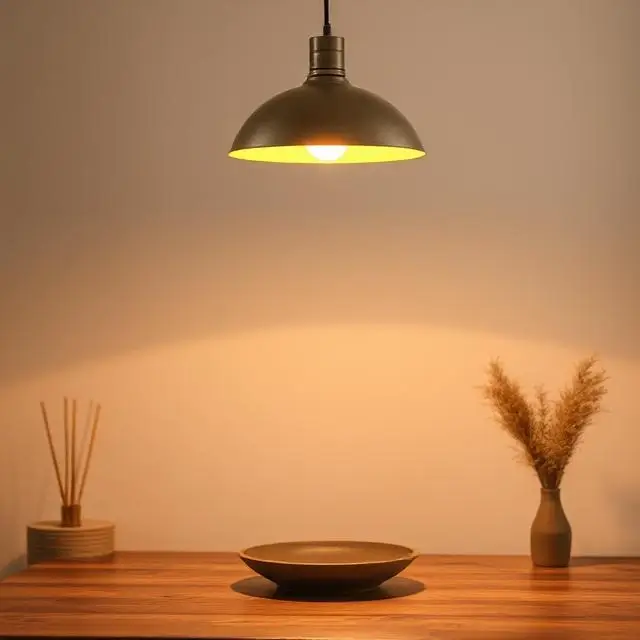 A single warm pendant light over a table